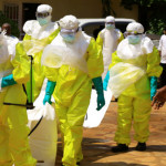 Congolese officials and the World Health Organization officials wear protective suits as they participate in a training against the Ebola virus near the town of Beni